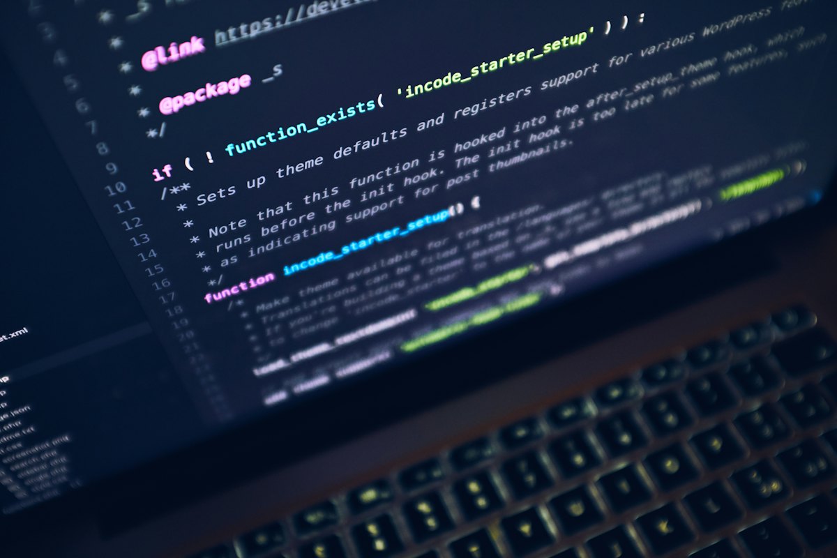 Laptop on a desk showing a website project